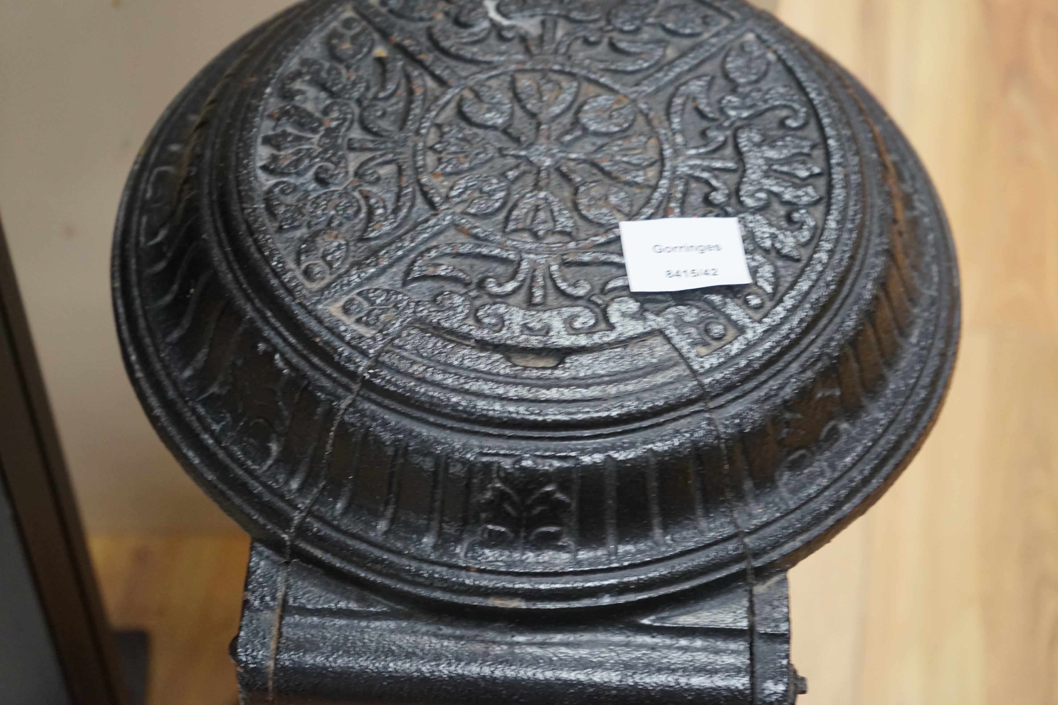 A black cast iron stove - 'The Slogan Stove’, 58cm high